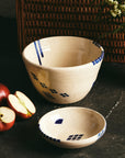 natural color bowls with bartblanc designs in royal blue