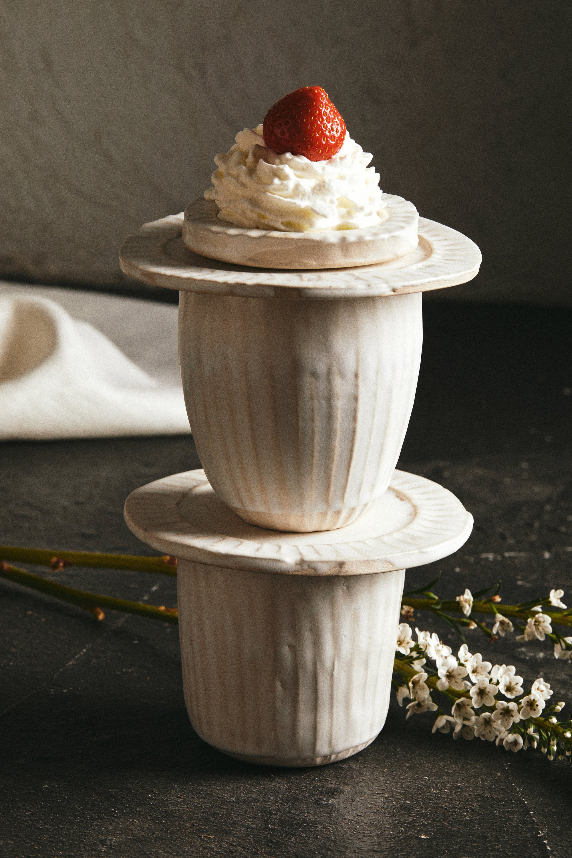 white cups and plates from Bartblanc's organics collection