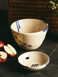 natural color bowls with bartblanc designs in royal blue